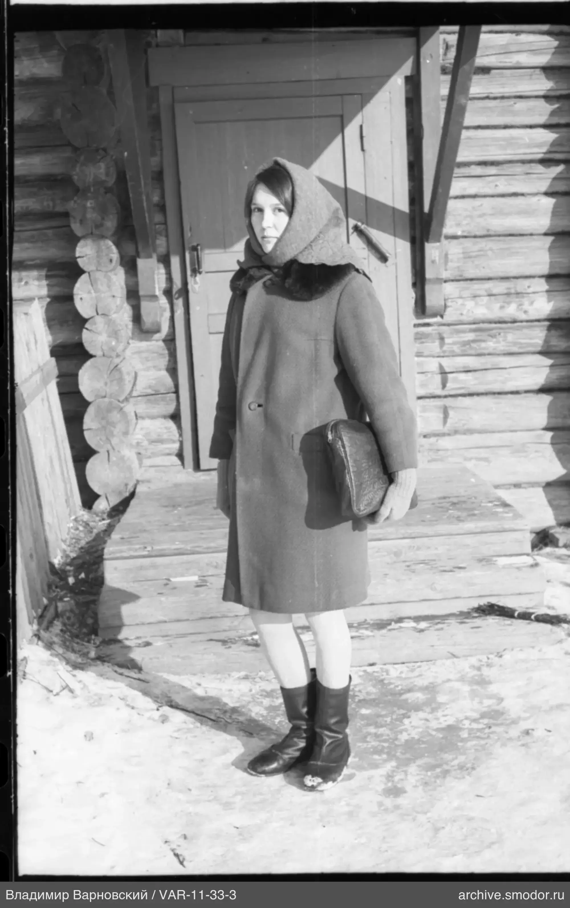 Woman on porch by door with lock
