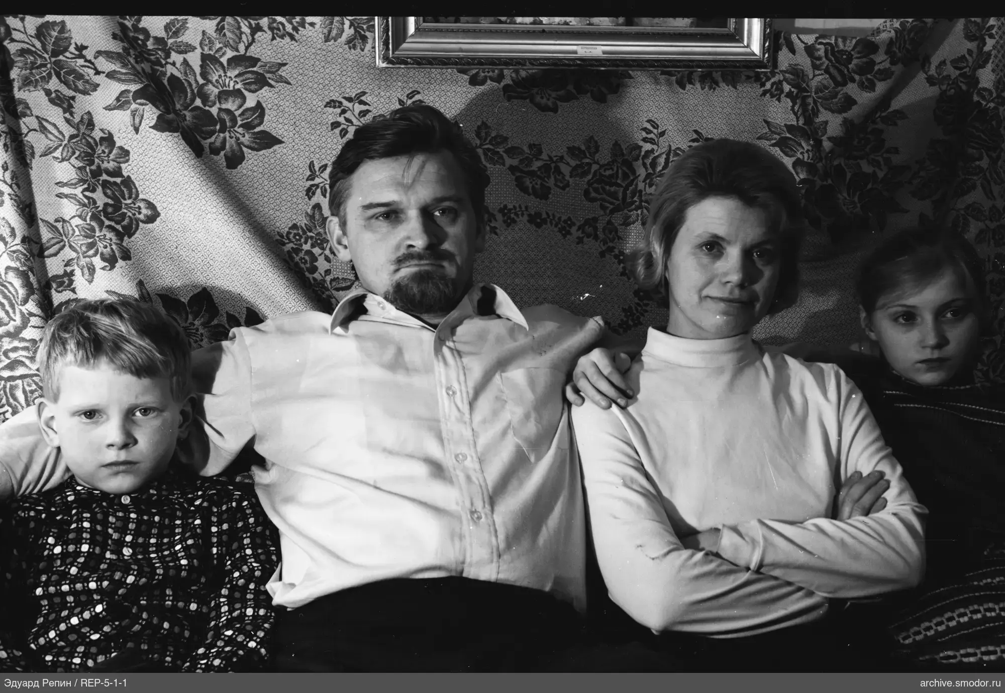 Group portrait against patterned wall