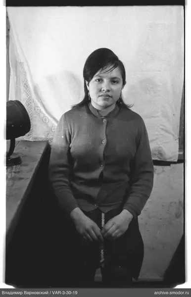 Portrait of a woman in a cardigan and skirt