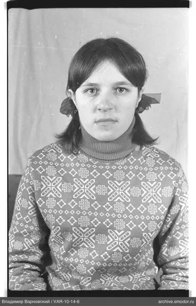Portrait of a woman in patterned sweater