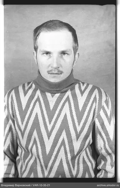 Portrait of a man in a patterned sweater