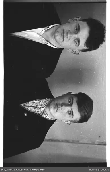 Two young men in jackets and shirts