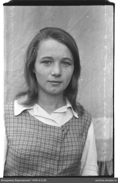 Portrait of a woman in a light shirt and vest