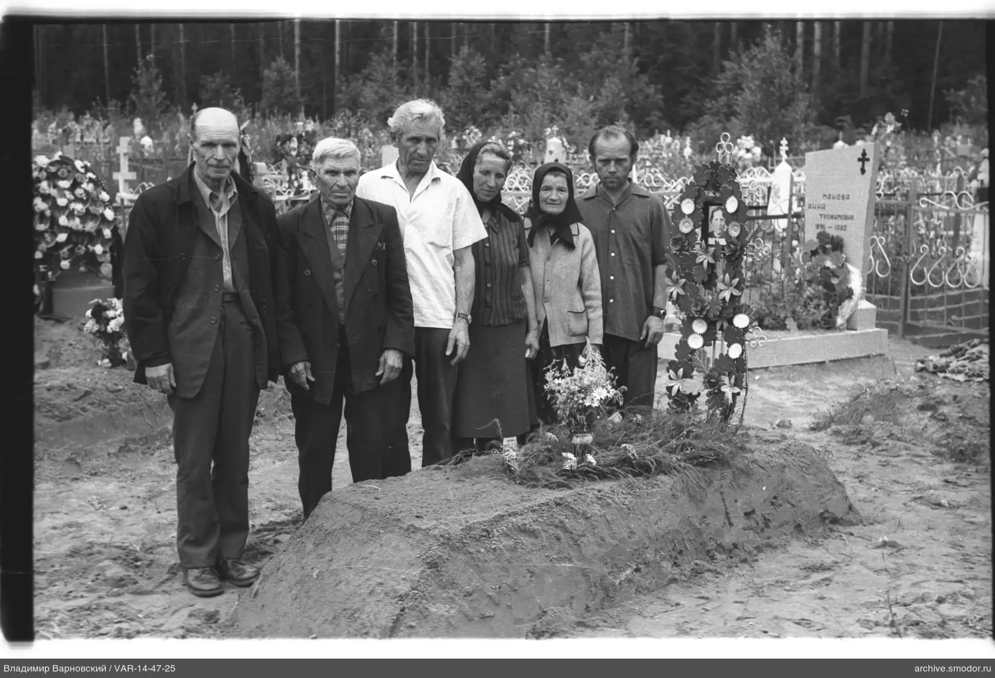 Group of people at fresh grave