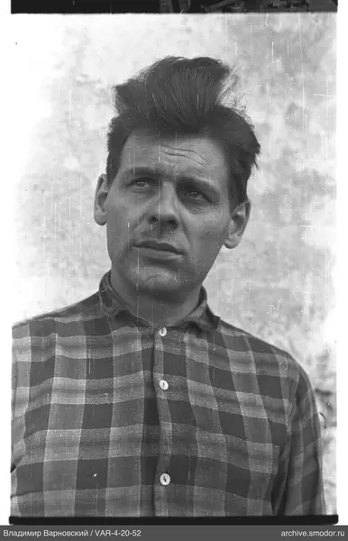 Portrait of a man in a checkered shirt
