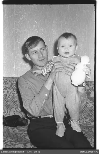 Man with a child on his lap