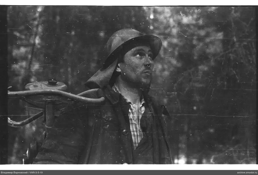 Man with helmet and shoulder device