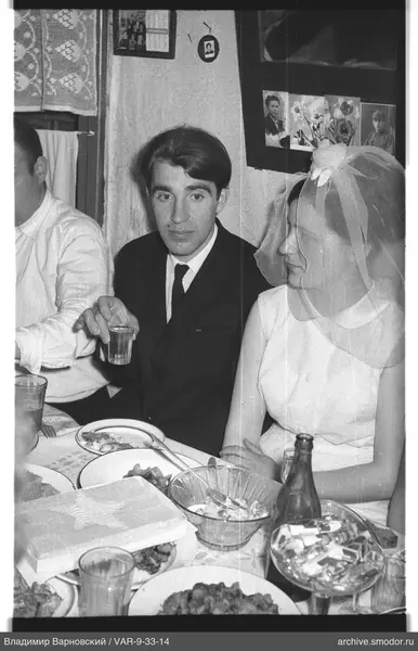 Group sitting at a table with food and drinks
