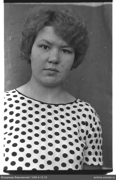Portrait of a woman in a light blouse
