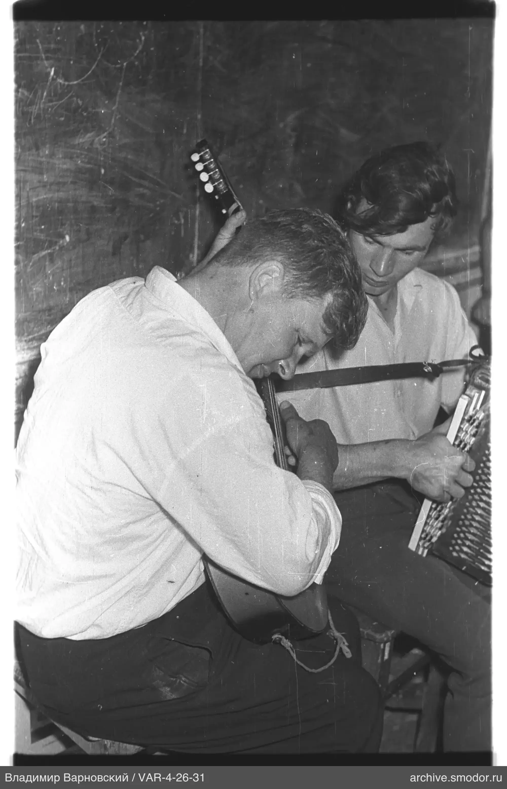 Two men with musical instruments