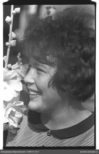 Profile portrait of a woman with flowers