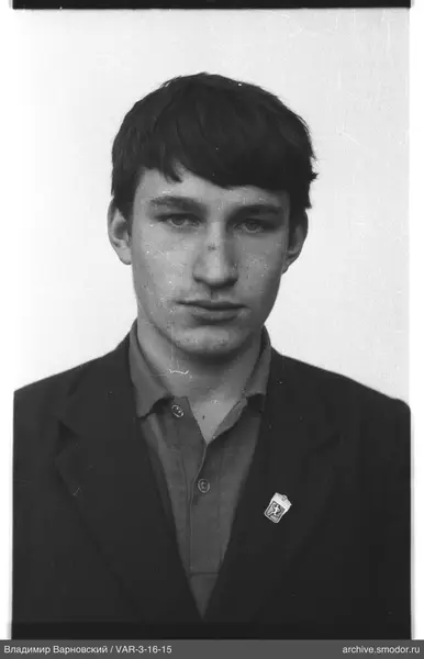 Portrait of a man with a running person badge
