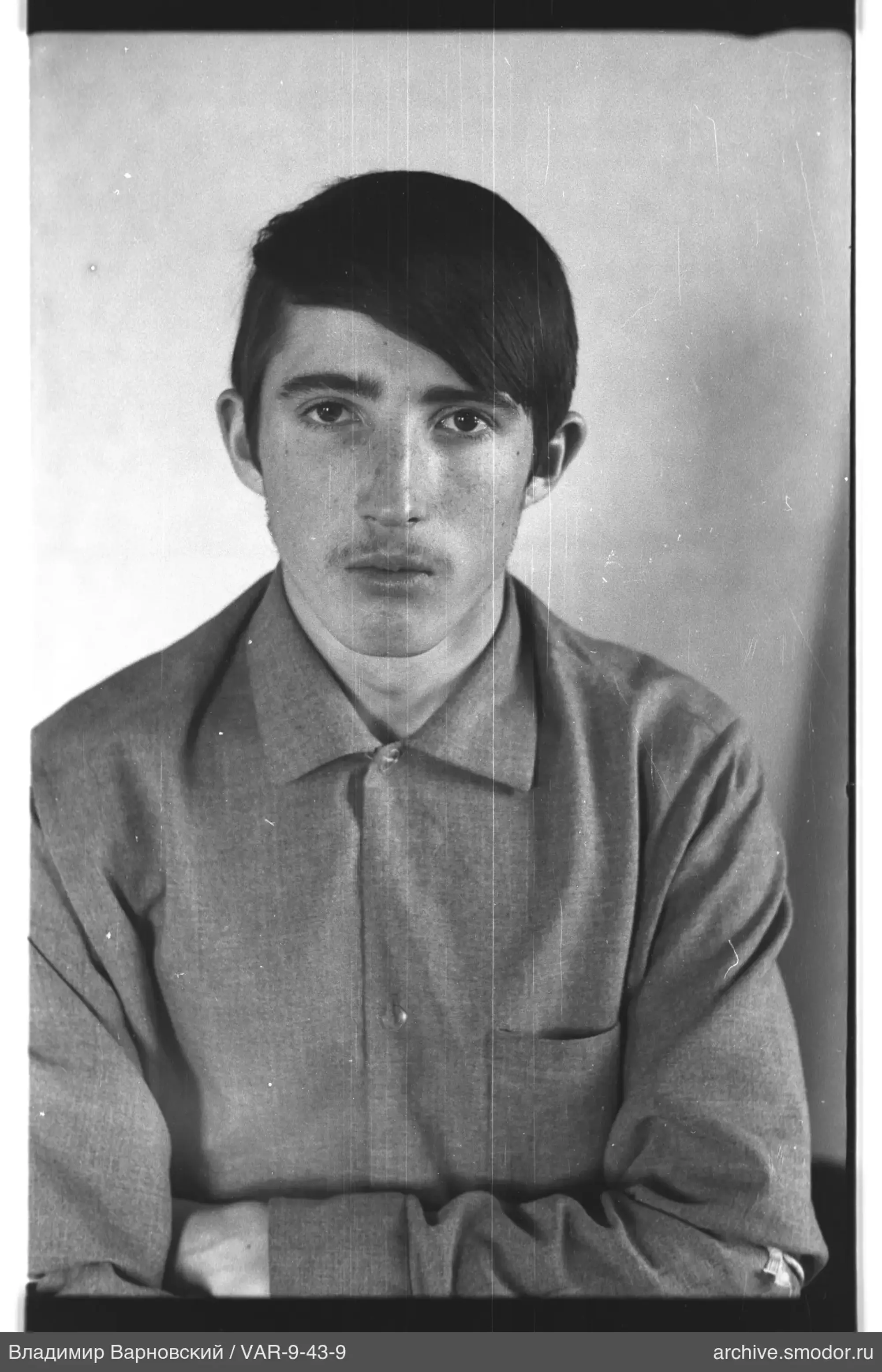 Portrait of a man with short dark hair