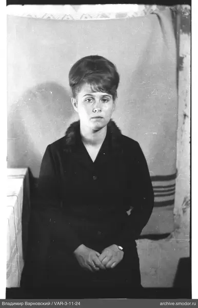 Portrait of a woman in a dark coat