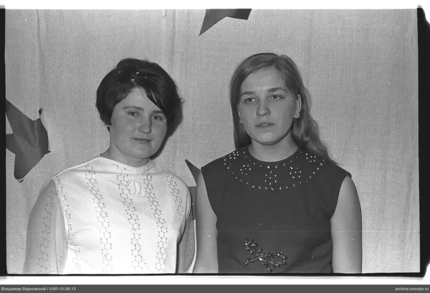 Two women against star-patterned fabric background