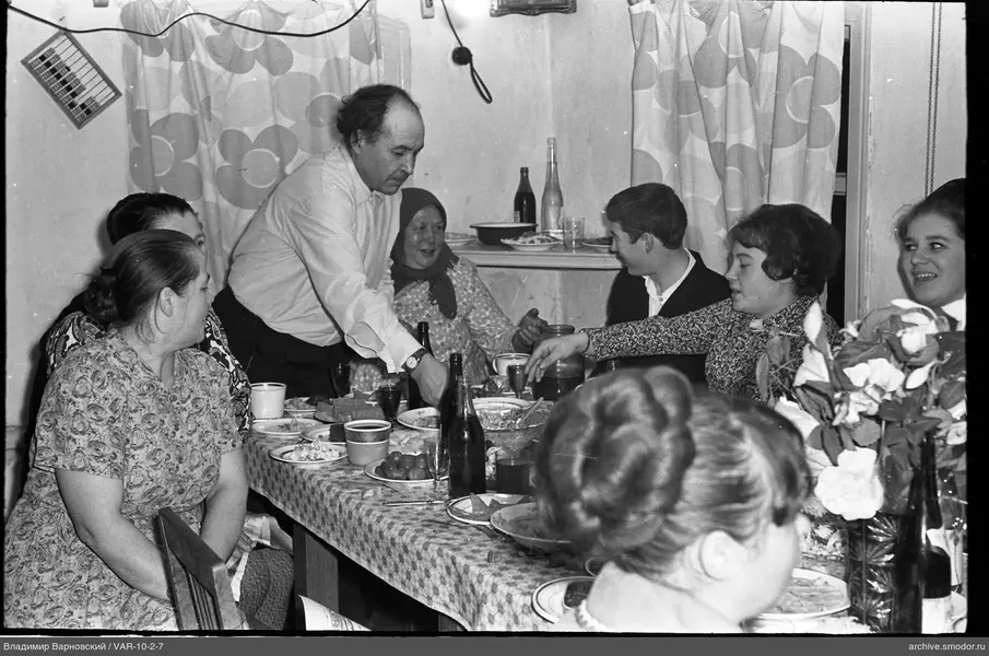 Group sitting at a table in a room
