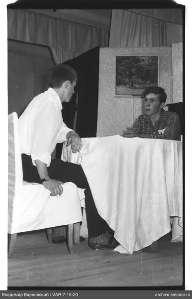 Two young men sitting at a table