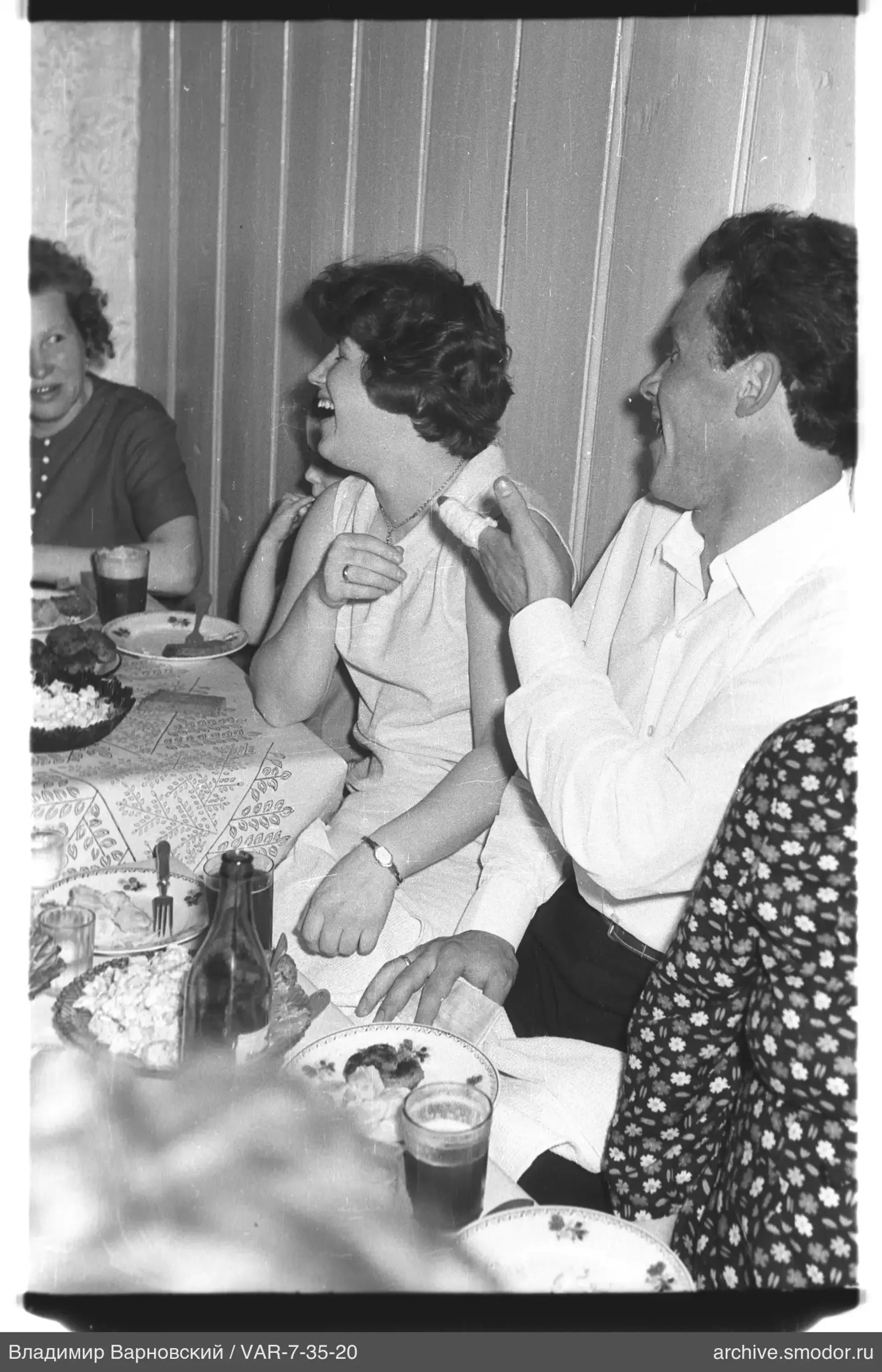 People sitting at a table during an event