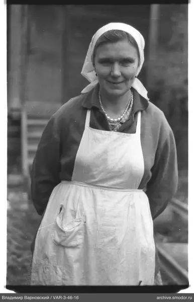 Portrait of a woman with a headscarf and pearl necklace