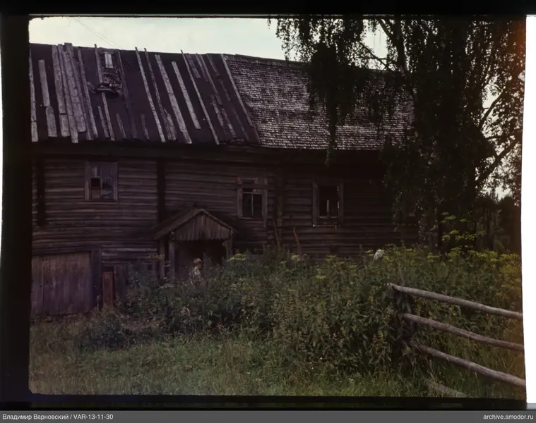 Wooden house with person on porch