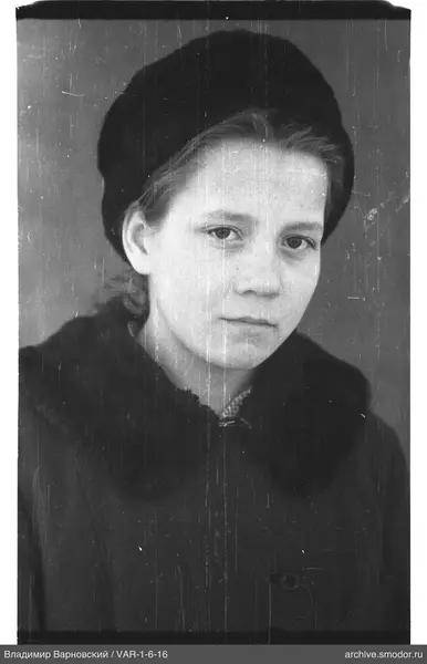 Portrait of a woman in a dark hat and coat