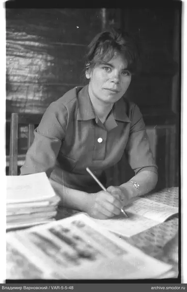 Woman writing at a table