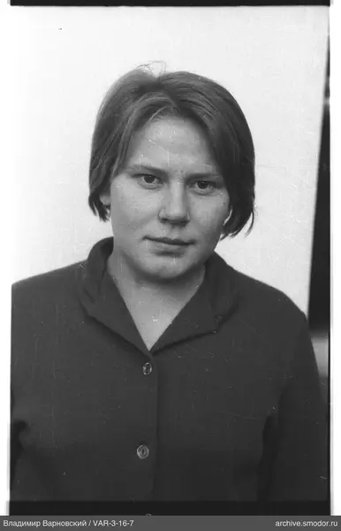 Portrait of a woman in a dark cardigan
