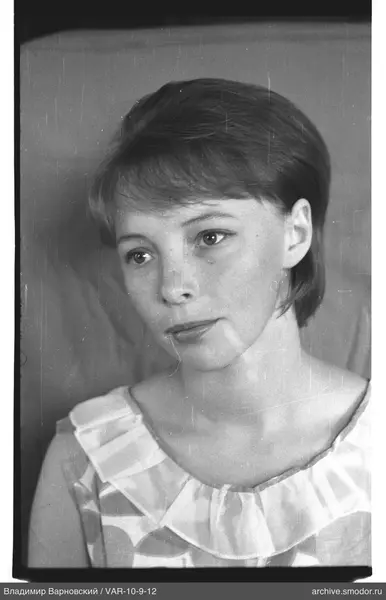 Bust portrait of a woman with short light hair