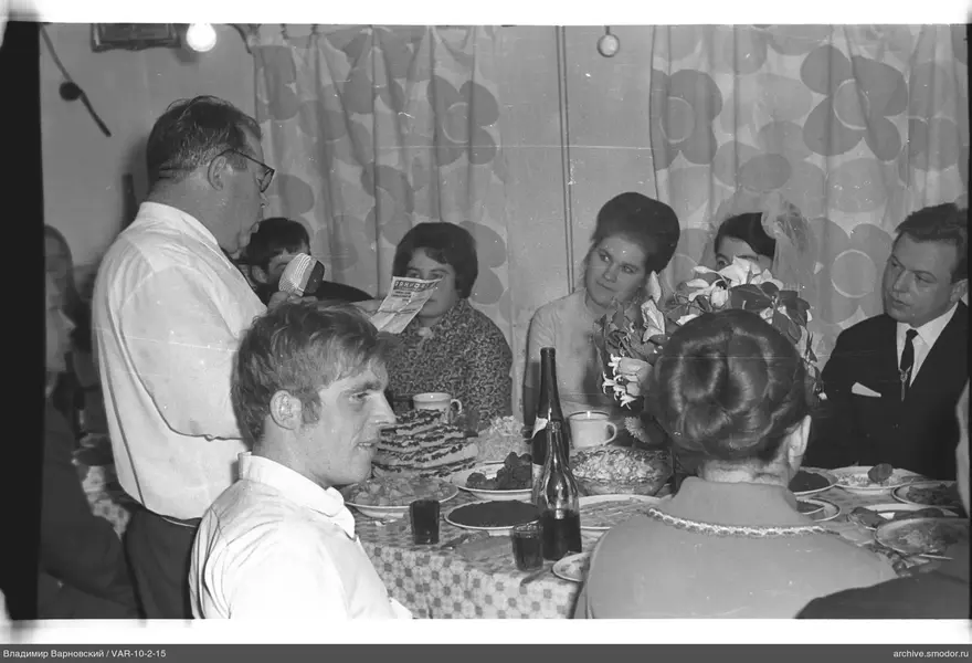 Man with microphone at the table