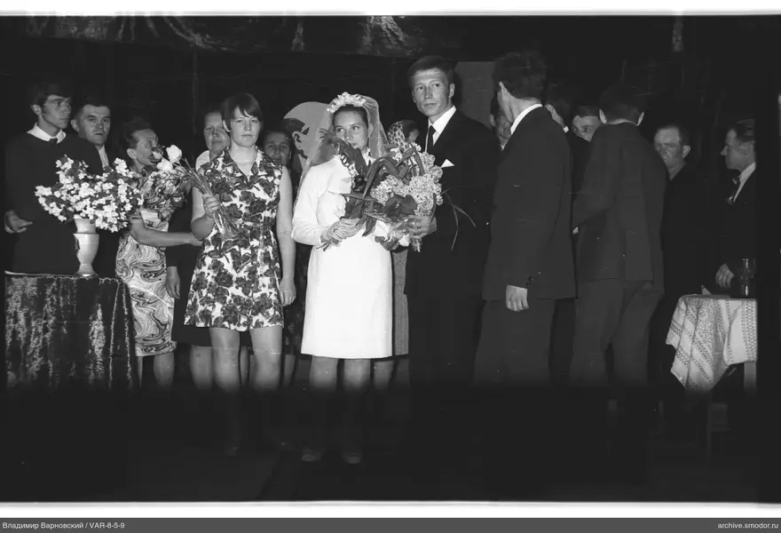Group portrait with woman in veil and bouquet
