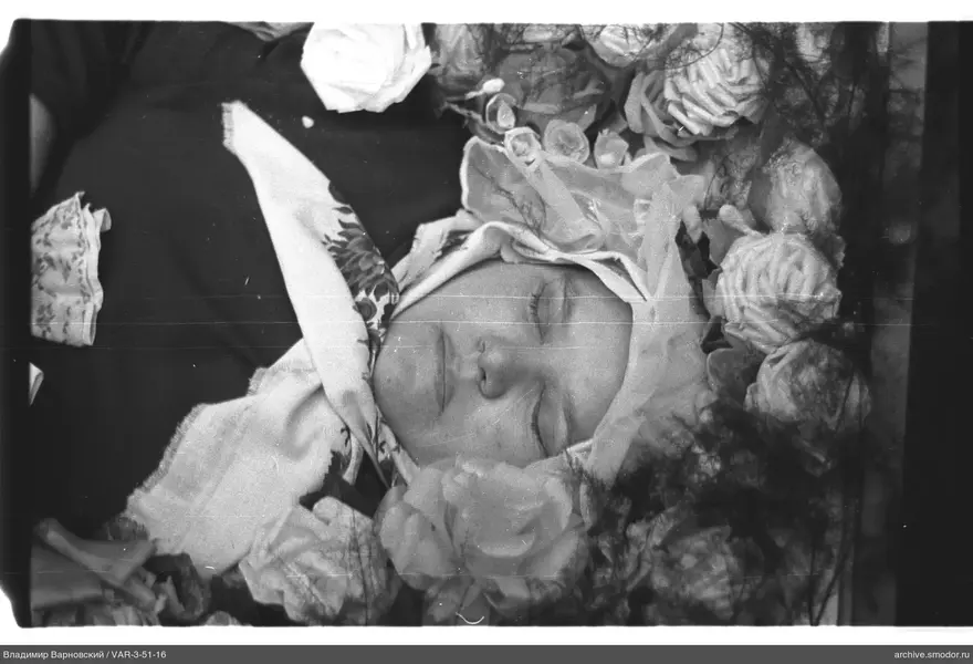 Portrait of a woman with floral headpiece and ornaments