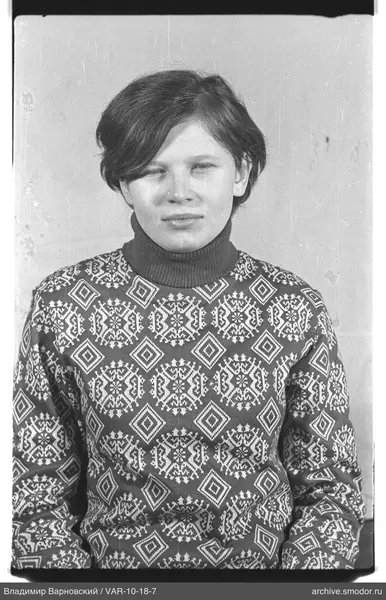Portrait of a woman in a patterned sweater