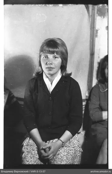 Portrait of a woman with short light hair