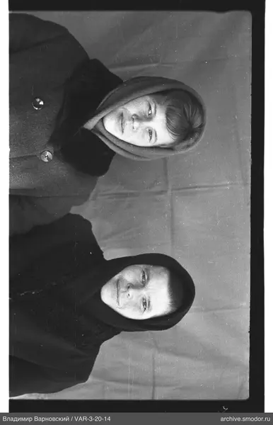 Two women with headscarves in group portrait