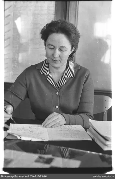 Bust portrait of a woman reading and writing