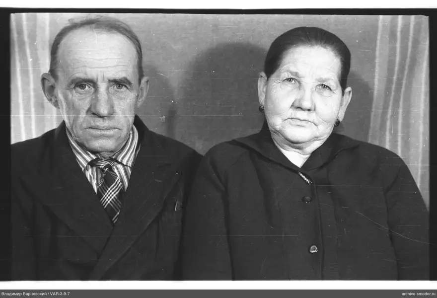 Man and woman in group portrait