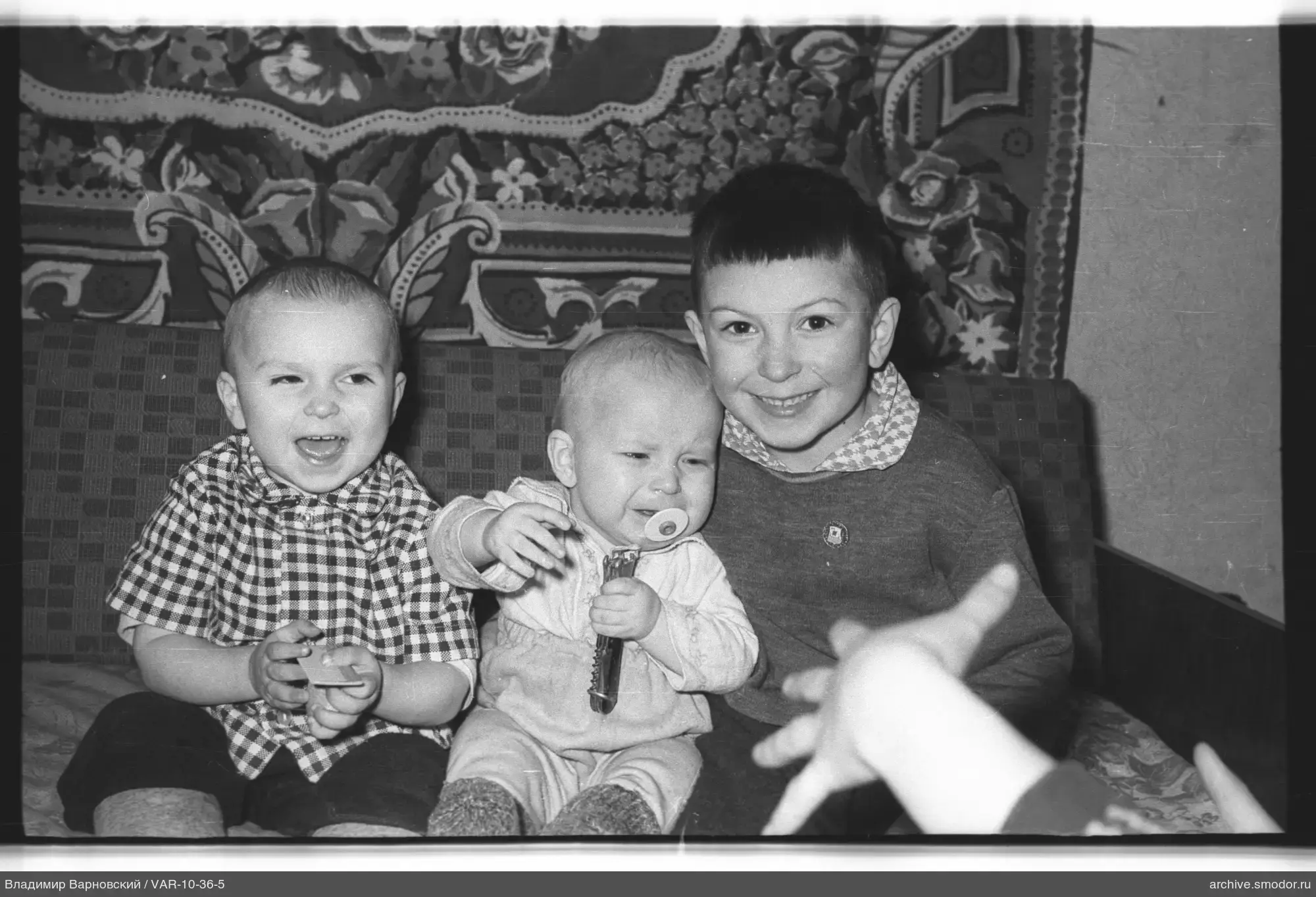 Group portrait of children on sofa
