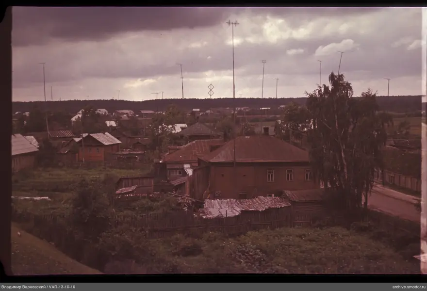 Village settlement with antennas and trees