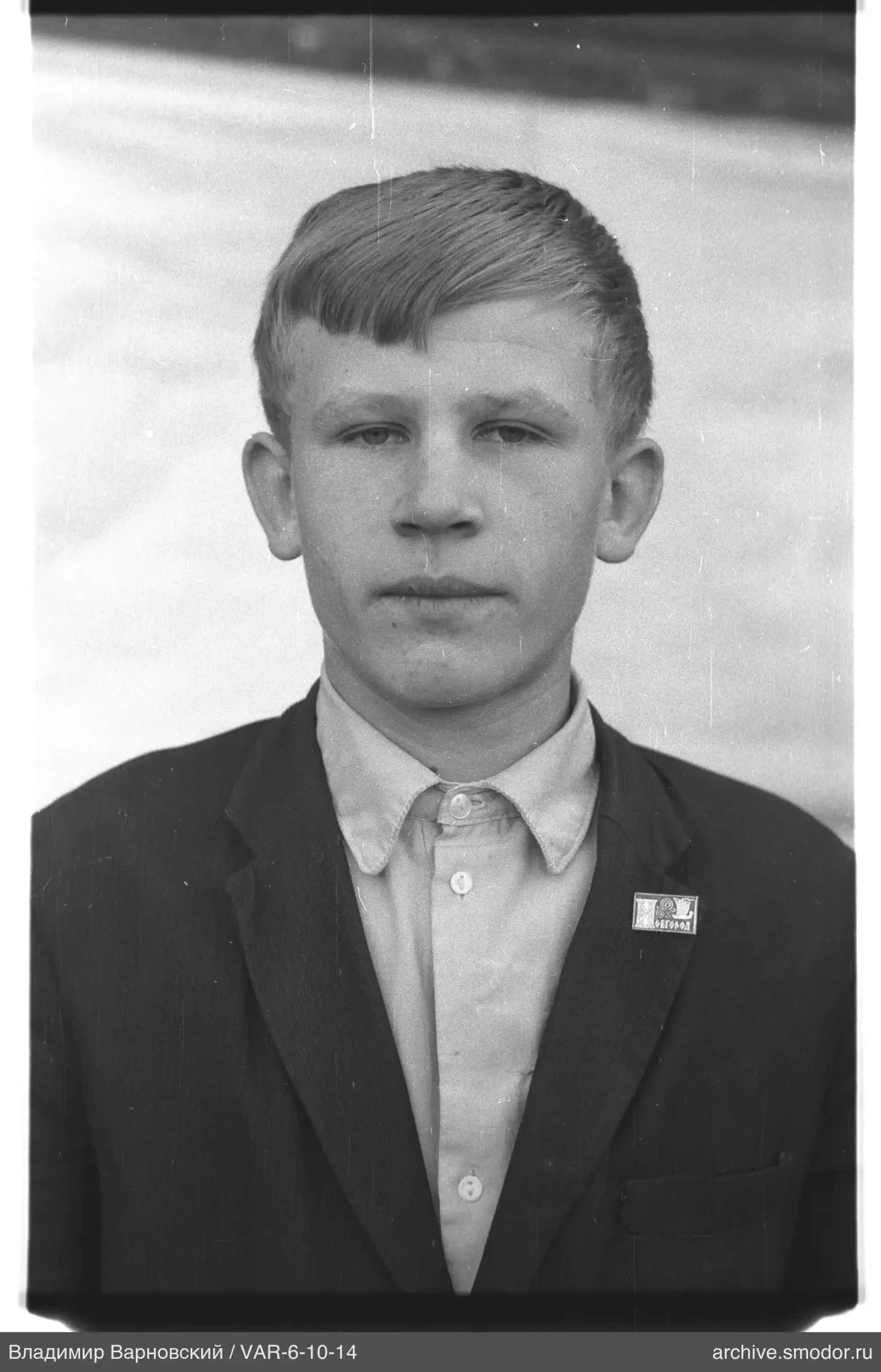 Portrait of a young man with badge
