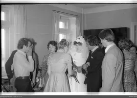 Group portrait with woman in wedding dress