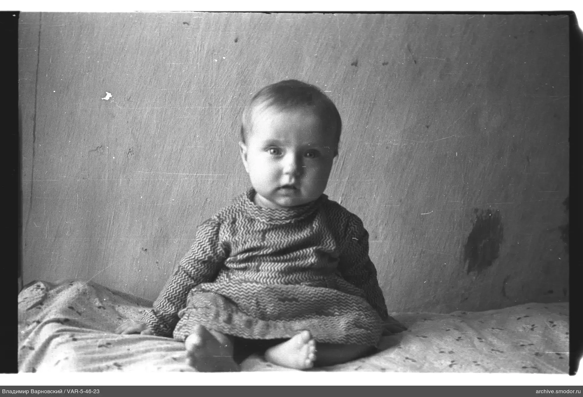 Child sitting on a blanket