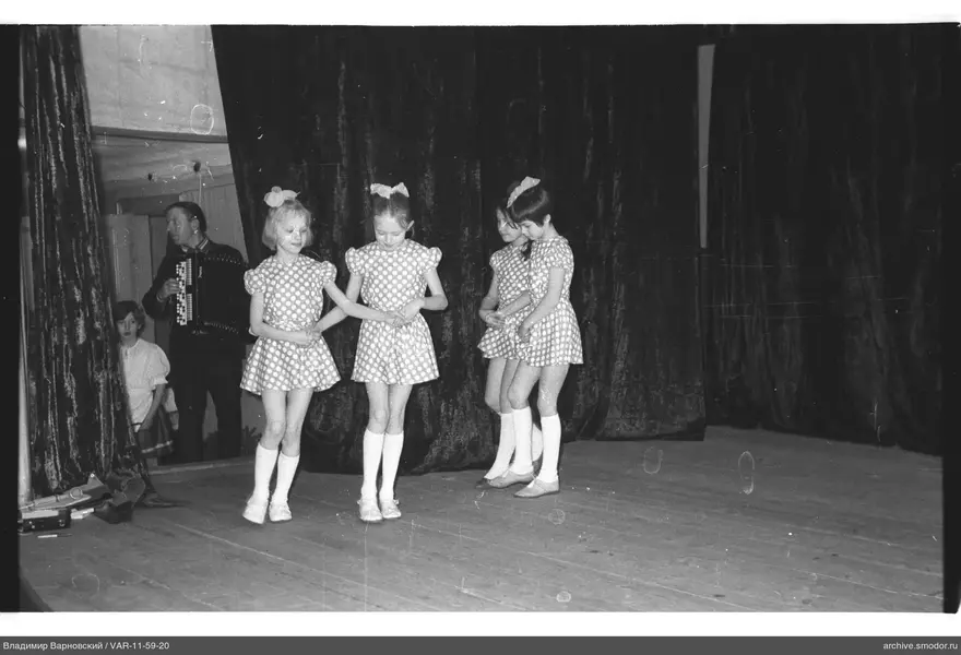 Girls in matching dresses on stage