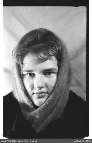 Portrait of a woman in a dark coat and scarf