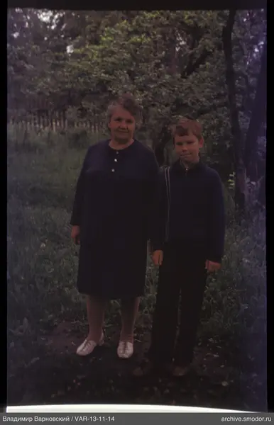 Group photo of woman and boy outdoors