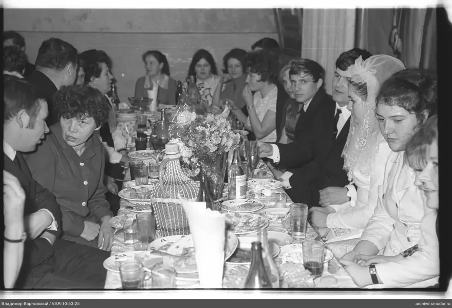 Group portrait at a formal dinner table
