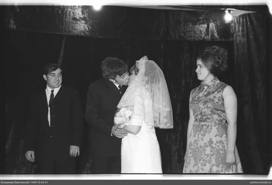 Group portrait with woman in veil and bouquet