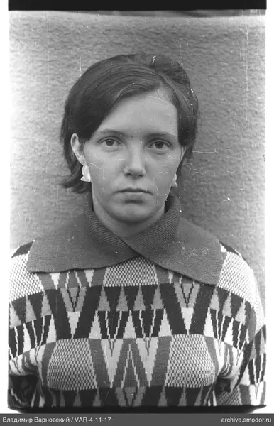 Portrait of a woman in a sweater and earrings