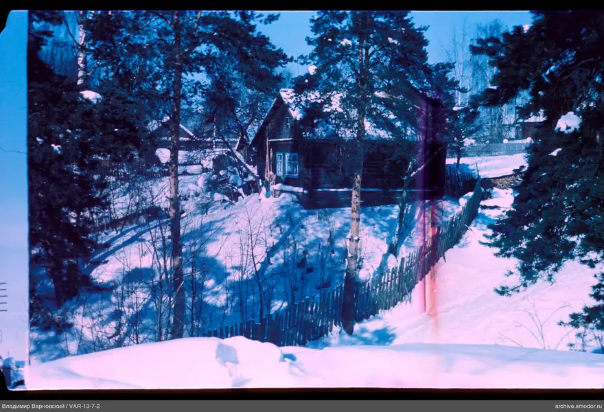 Wooden house with snowy slope