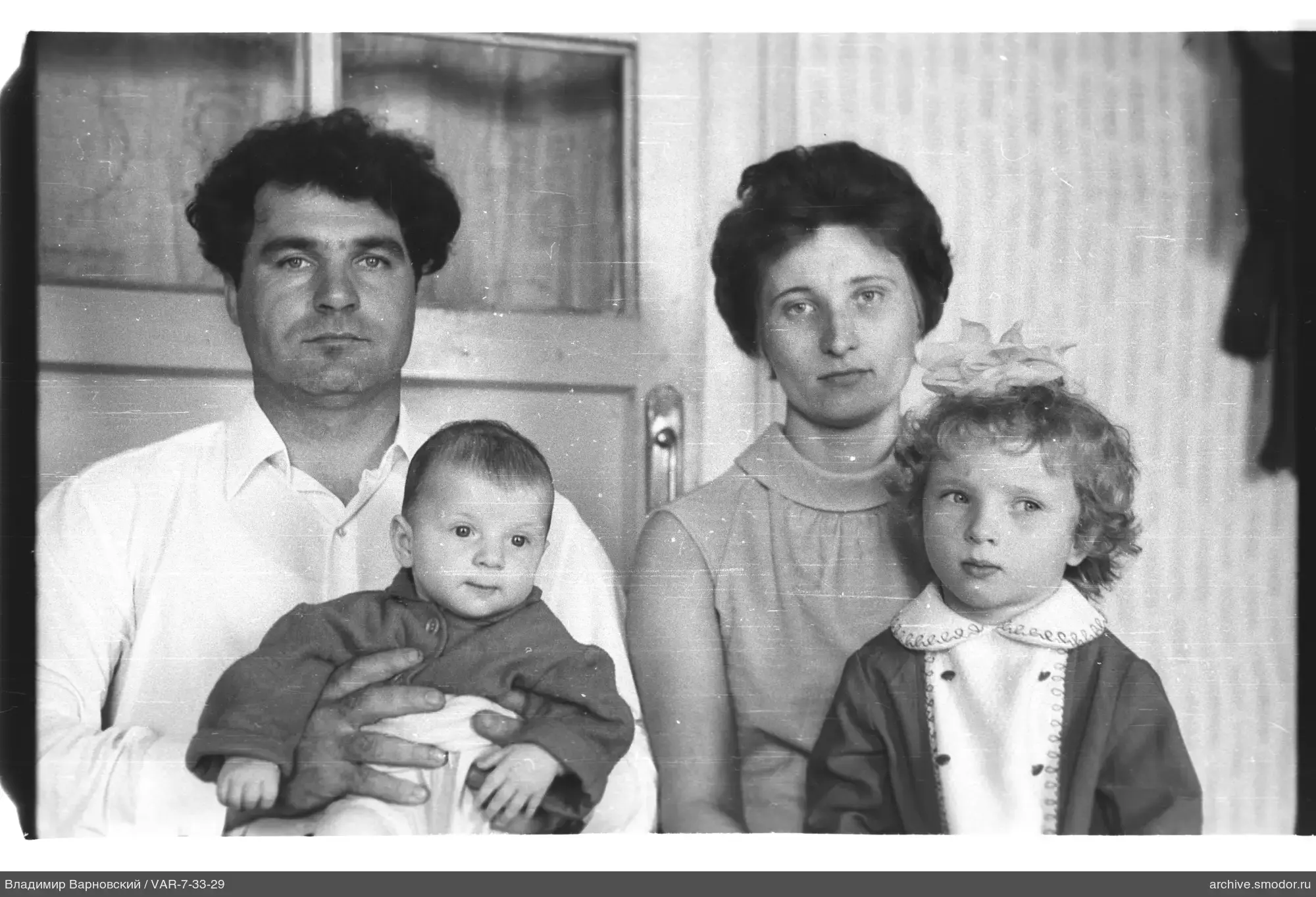 Group portrait with infant and girl