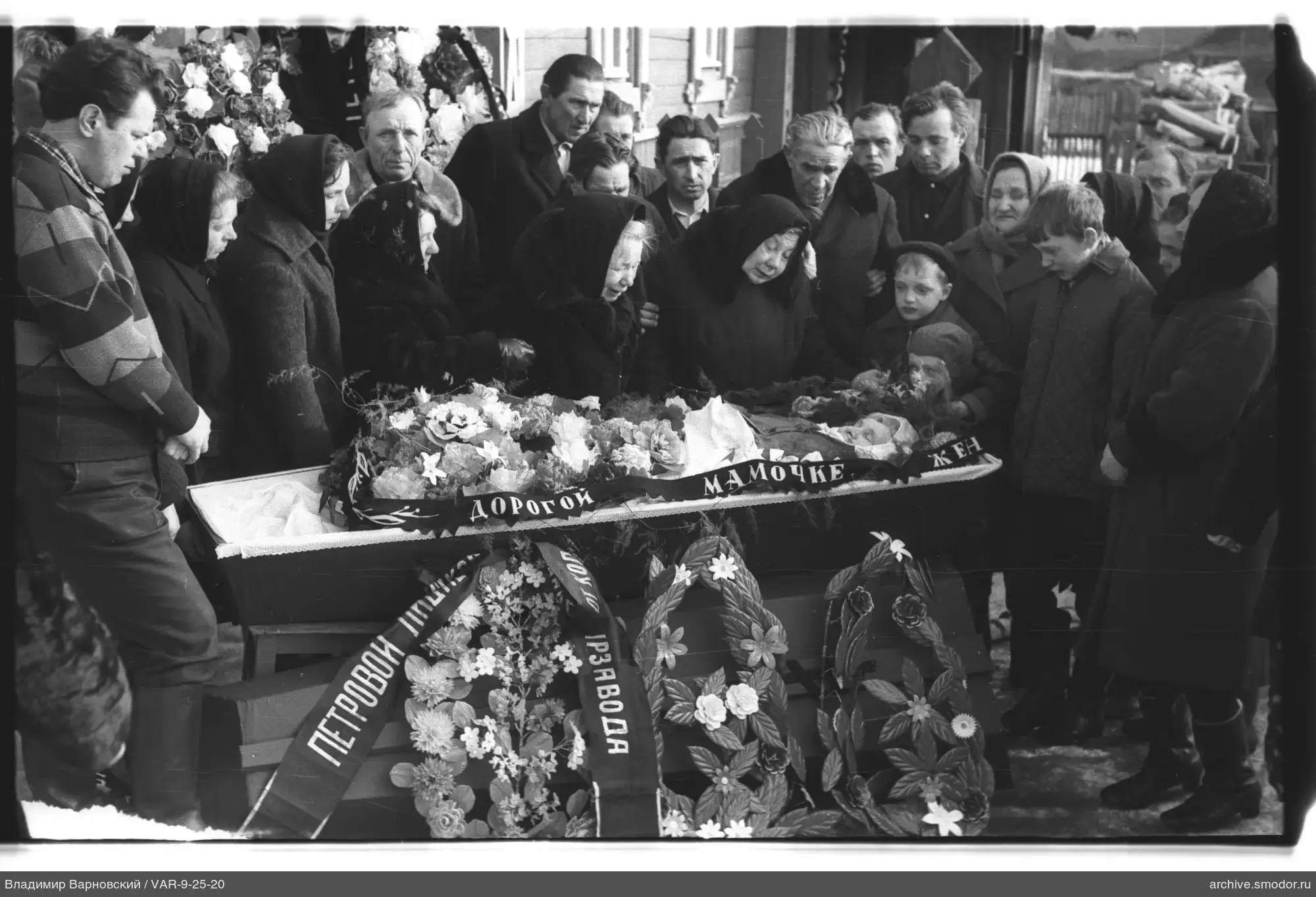 Group photo around the coffin